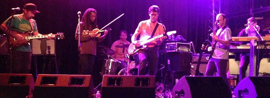 Humbucker is (left to right): David Burger (guitar), Robert Murphy (violin), James Movius (drums), Roddy Scheer (guitar), Jeff Ranish (bass), and Robert Fleming-Jones (keyboards).